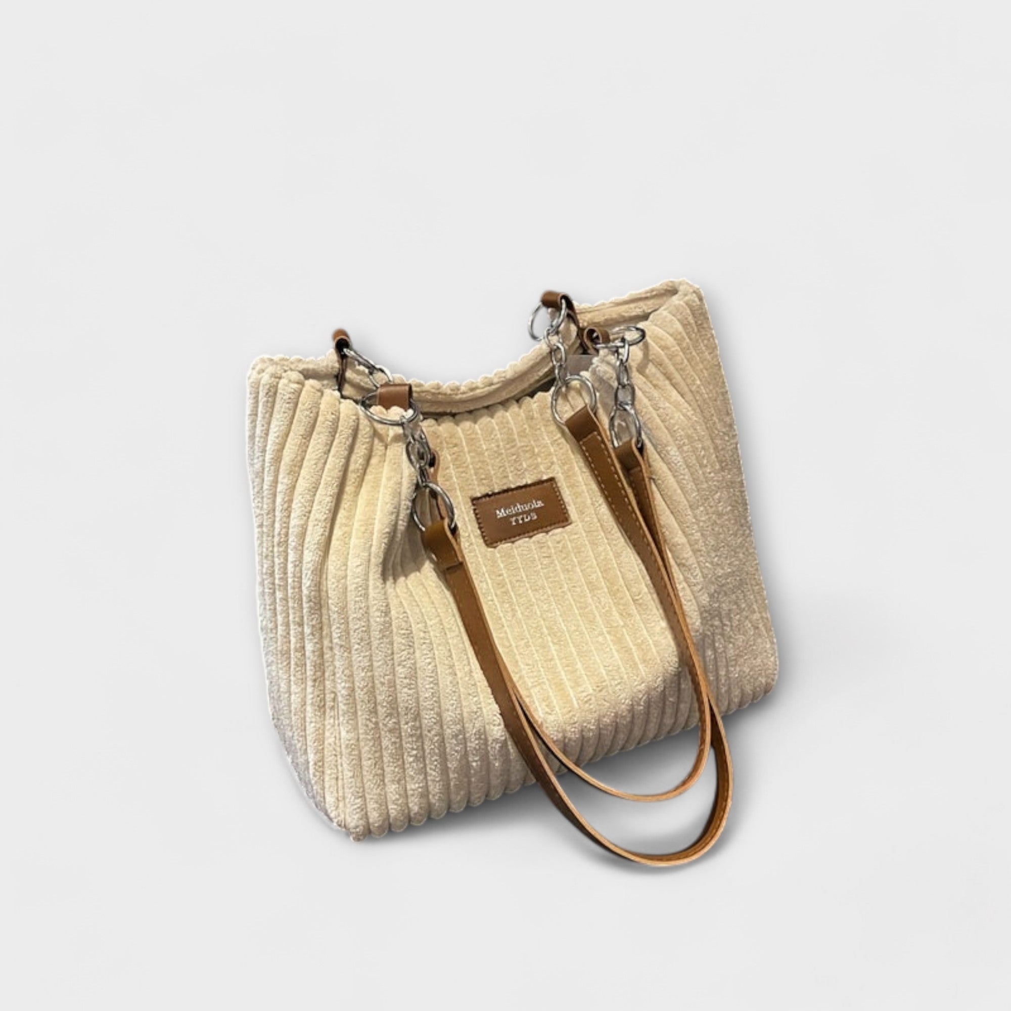 Aurora – Delicada bolsa de hombro de pana con un aire elegante